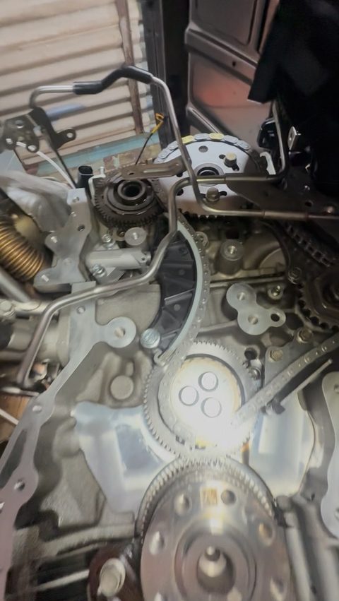 Front of an engine with the timing cover off, sprockets and timing drive exposed, at AGR Performance, Stafford